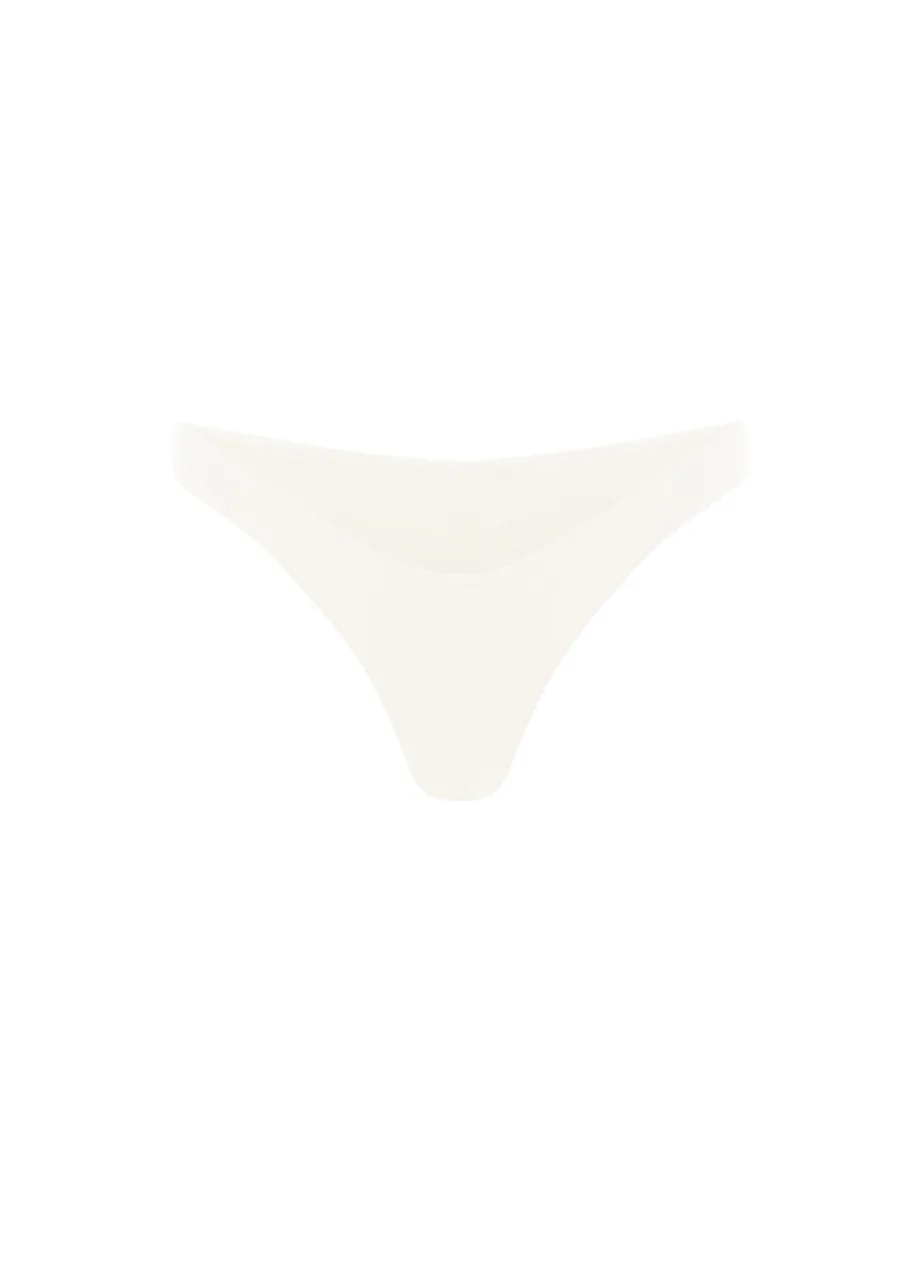11 › Str/Cd Wear Front view of a white thong-style bikini bottom. It's minimalist and high-cut on the sides.