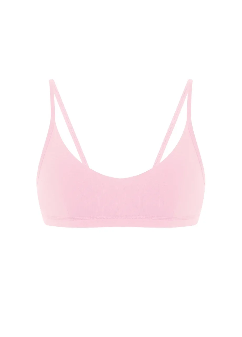 15 › Str/Cd Wear Light pink bralette-style bra with thin straps on a white background