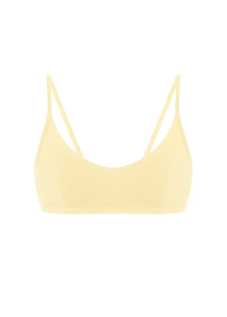 17 › Str/Cd Wear Light yellow bralette with thin straps and a scooped neckline.