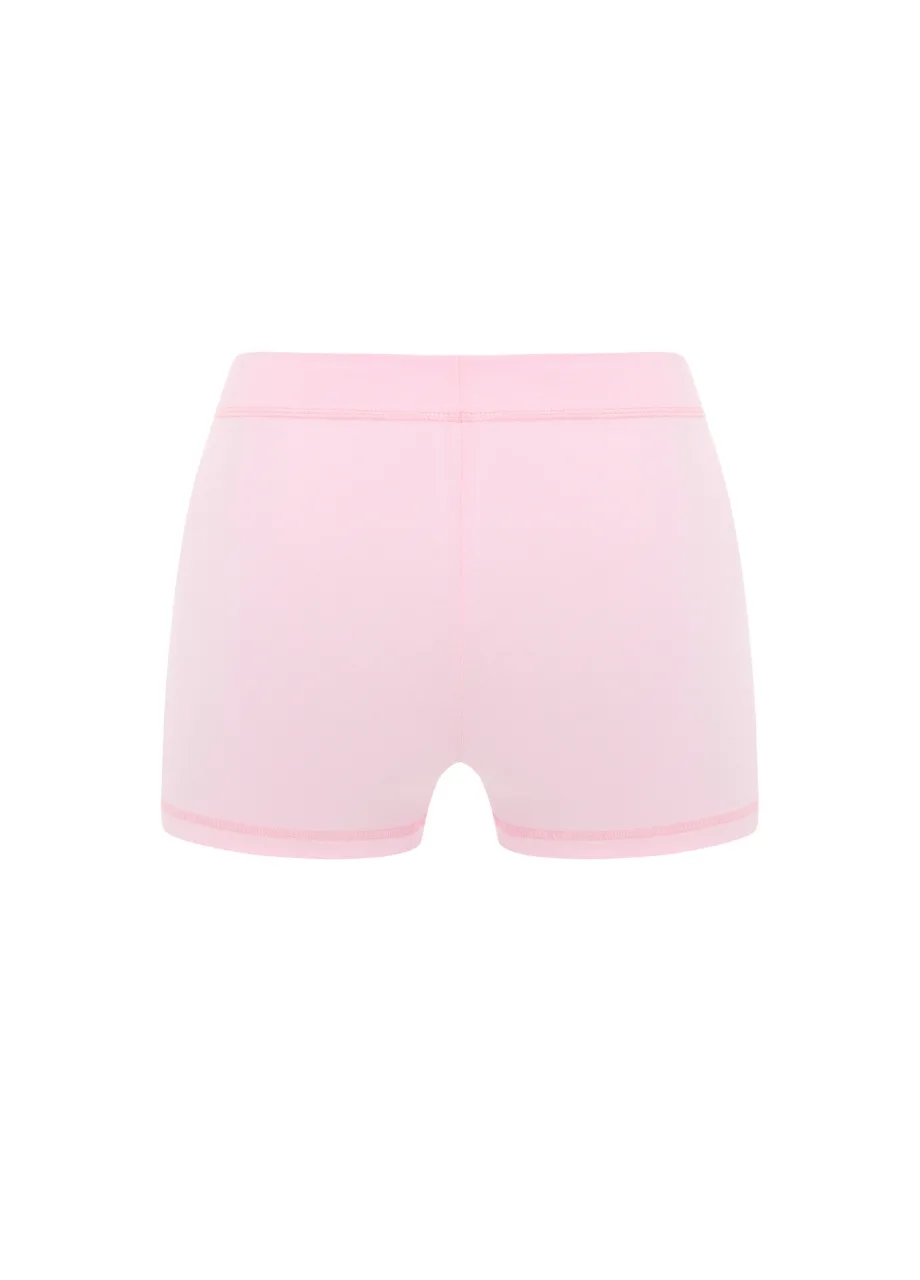 18 › Str/Cd Wear Back view of pastel pink athletic shorts with an elastic waistband and subtle pink stitching.