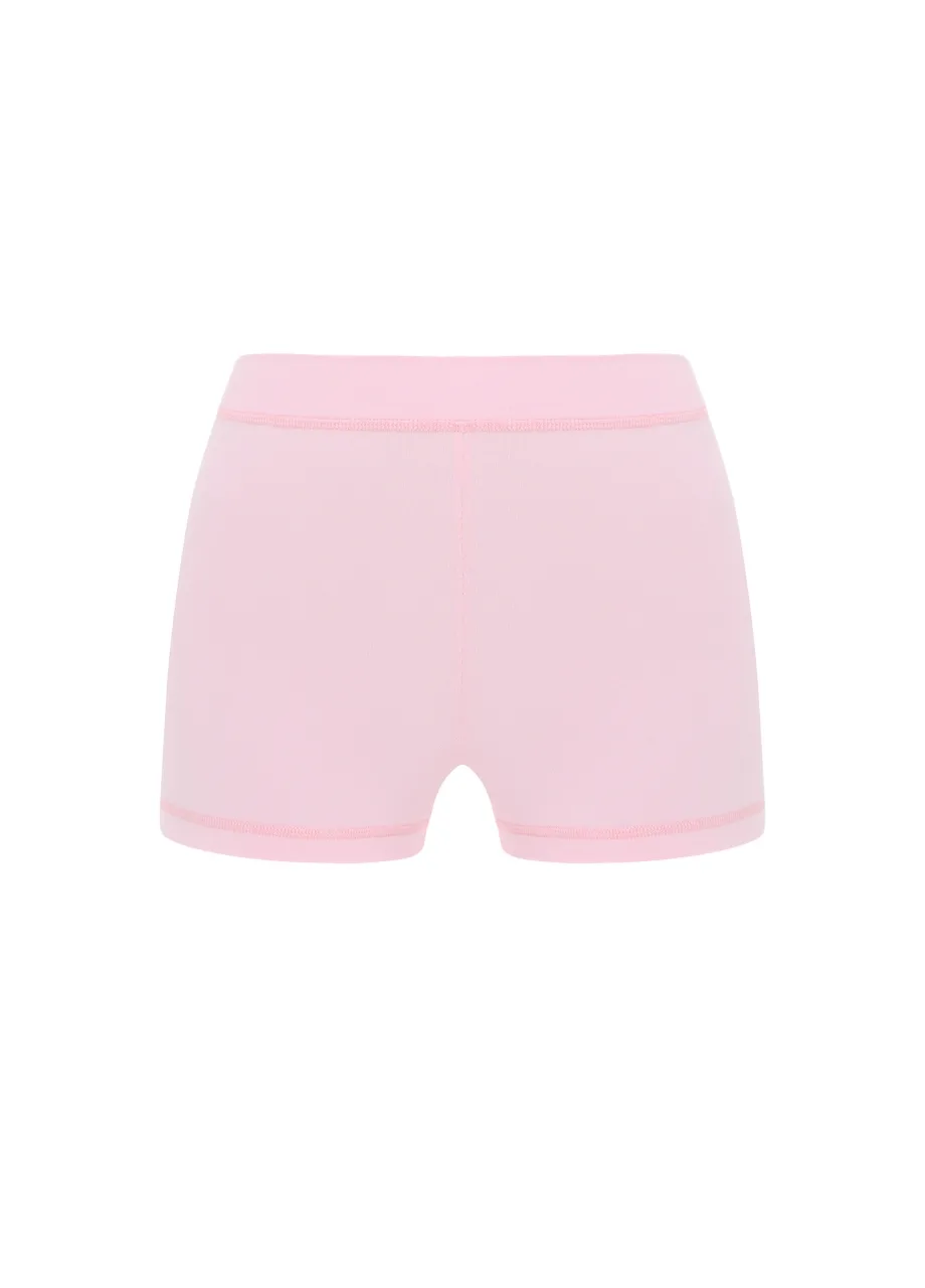 19 › Str/Cd Wear Light pink shorts with an elastic waistband, viewed from the back or rear.