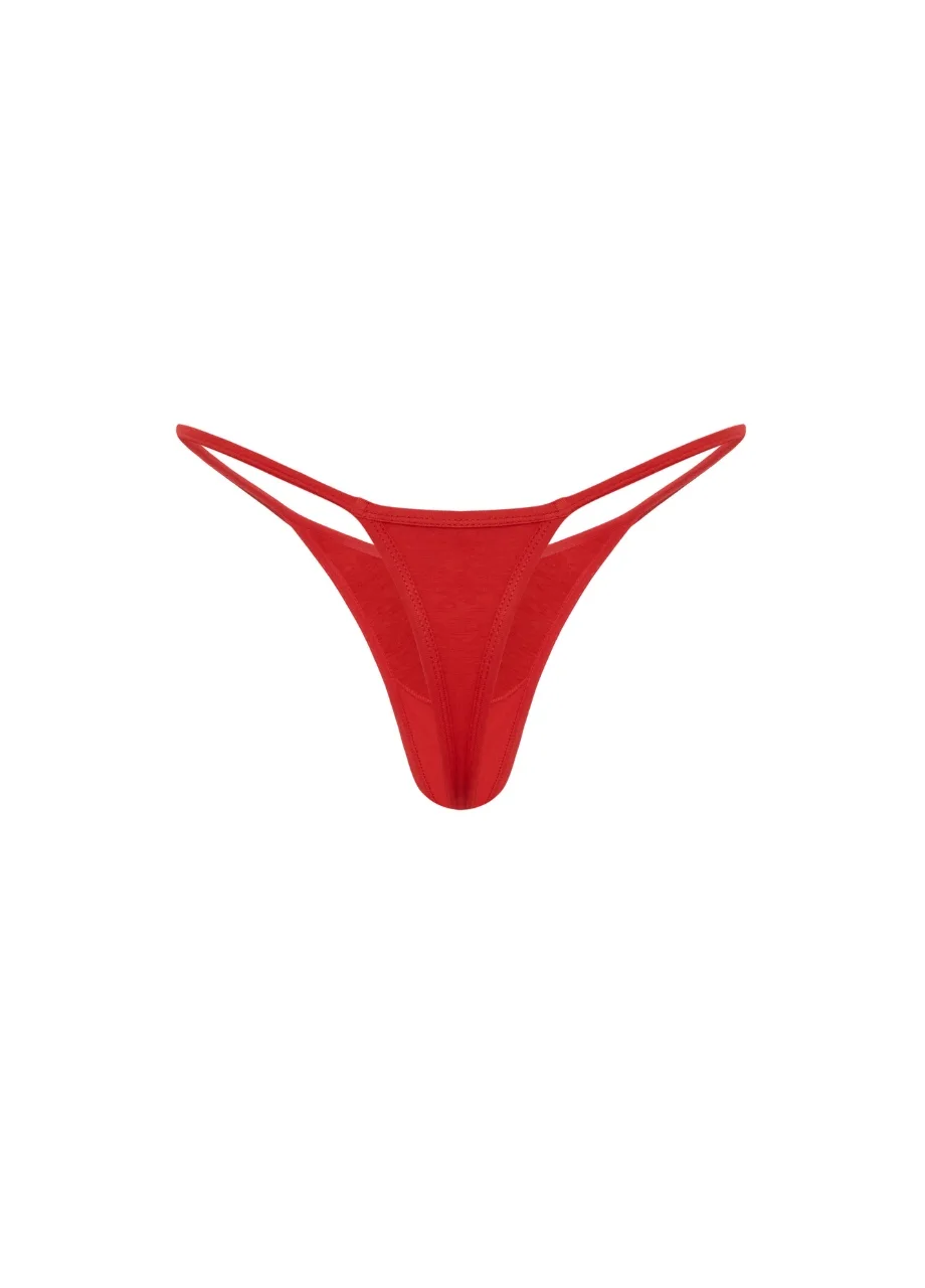 19 › Str/Cd Wear Red women's thong with thin side straps displayed against a white background, front triangular panel.