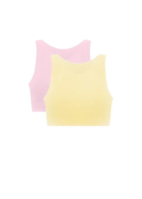 Two pastel crop tops, pink behind a yellow one, laid flat.