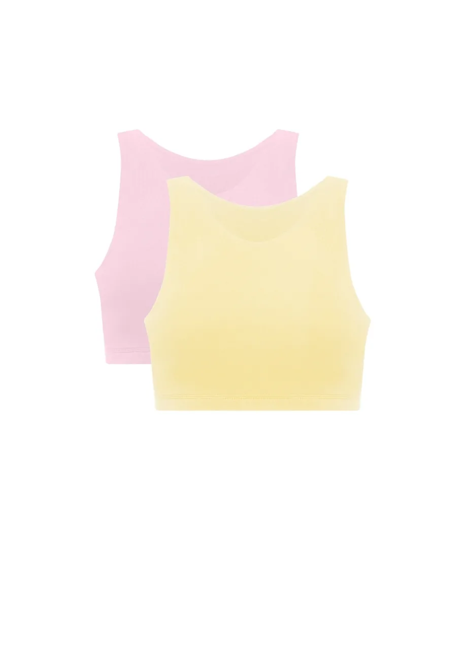 2 › Str/Cd Wear Two pastel crop tops, pink behind a yellow one, laid flat.