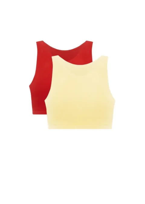 Two sleeveless crop tops layered together: a pale yellow top in front and a red top behind.