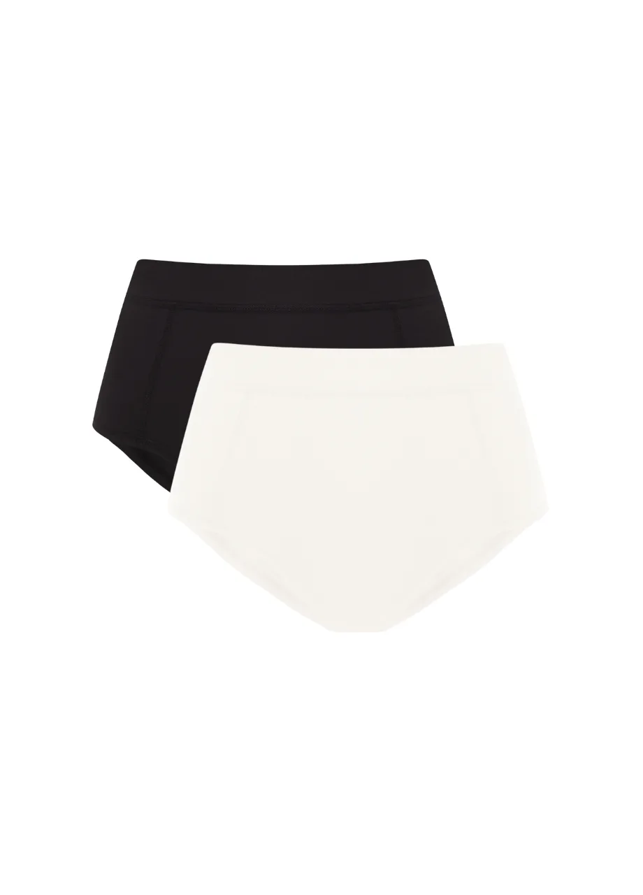 3 › Str/Cd Wear Two bikini bottoms, one black and one ivory, overlapped as a simple product image.