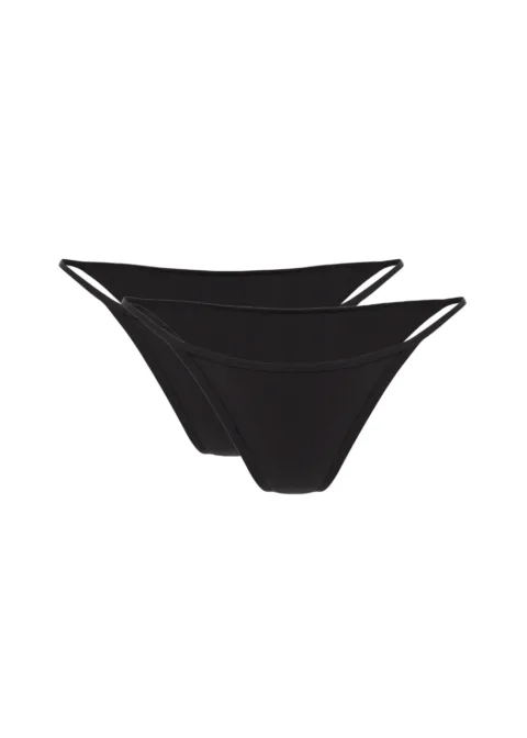 5 Two black bikini bottoms stacked with thin side straps on a white background