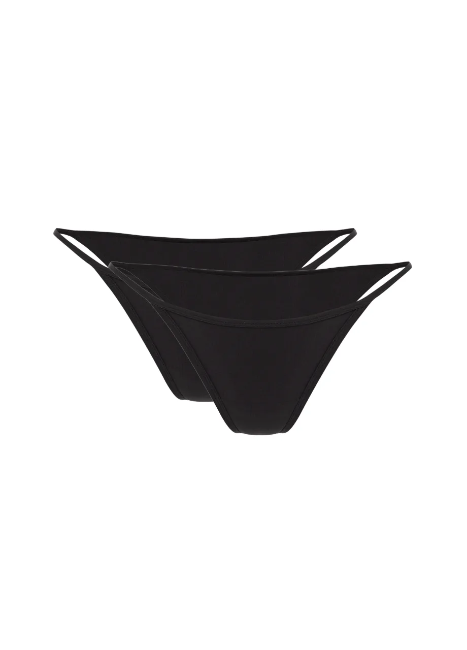 5 › Str/Cd Wear Two black bikini bottoms stacked with thin side straps on a white background