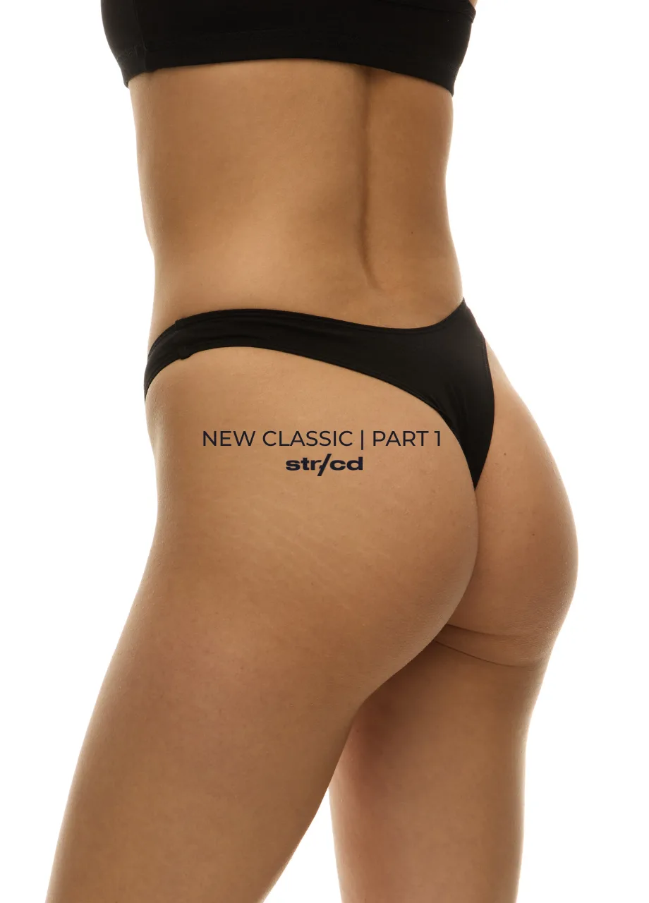 Side view of a woman in black bikini bottoms with 'NEW CLASSIC | PART 1' and 'str/cd' printed on her hip.