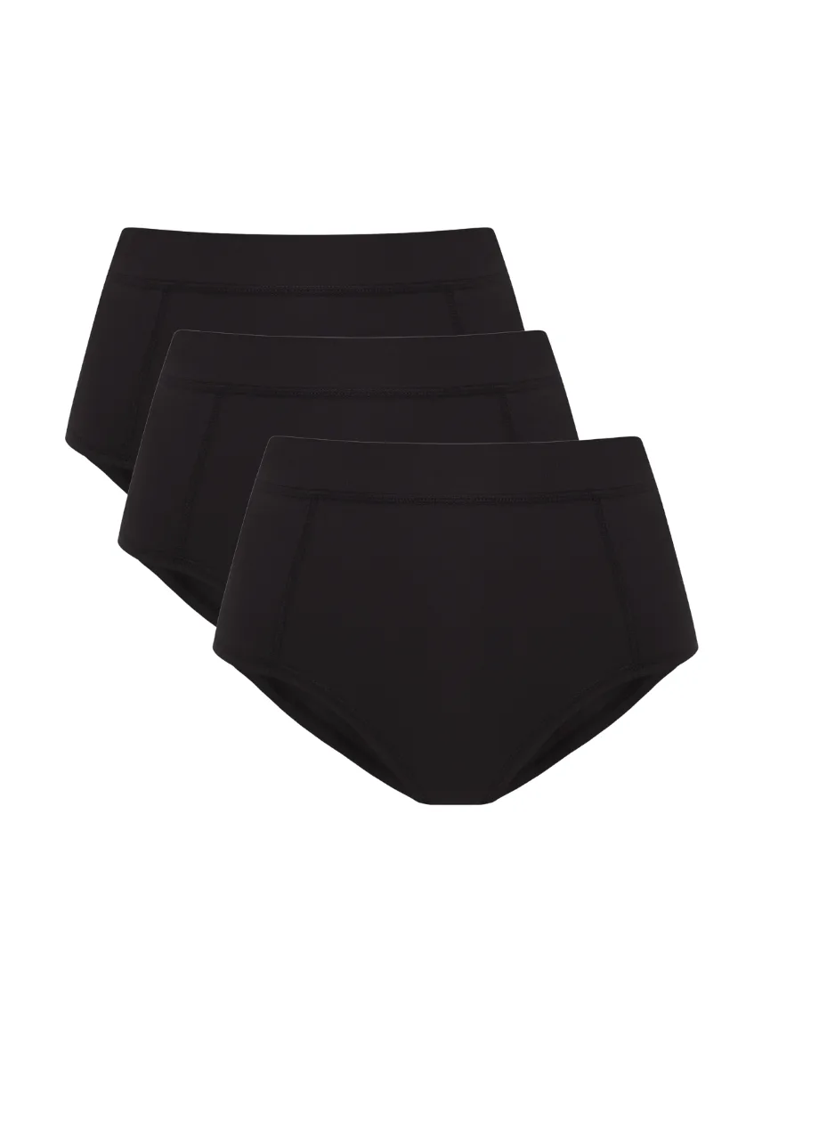 7 › Str/Cd Wear Set of four black high-cut briefs arranged in a diagonal stack.