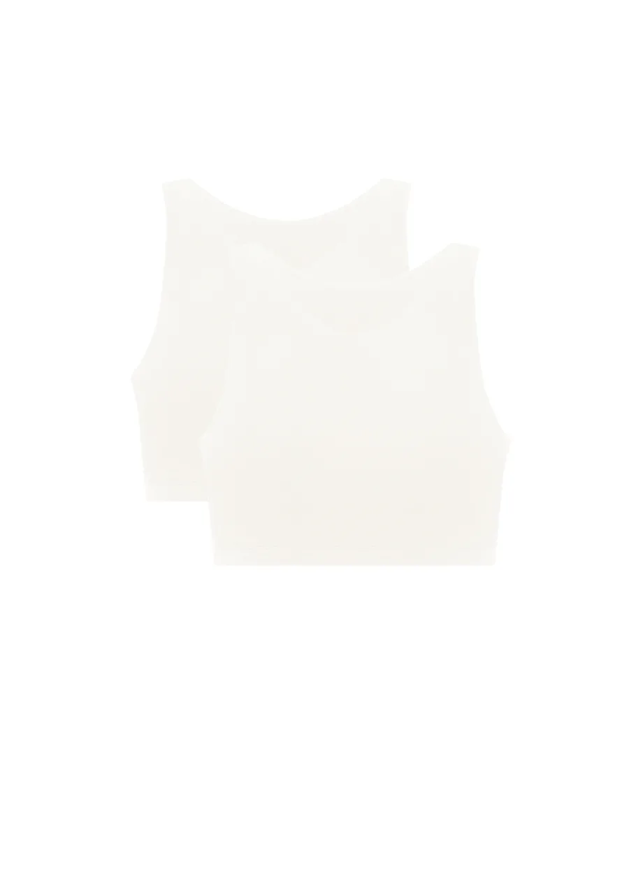 9 › Str/Cd Wear Two white sleeveless crop tops layered together against a white background.