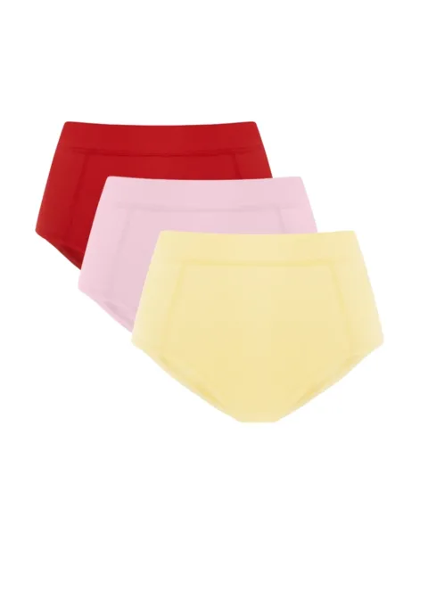 9 Three pastel bikini briefs stacked: red on top, light pink, and pale yellow at the front on white background