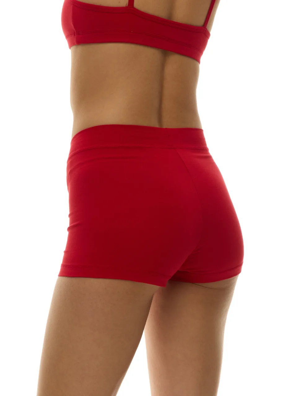 WU1313017 › Str/Cd Wear Back view of a person wearing a red sports bra and red athletic shorts, showing the torso and hips against a white background.