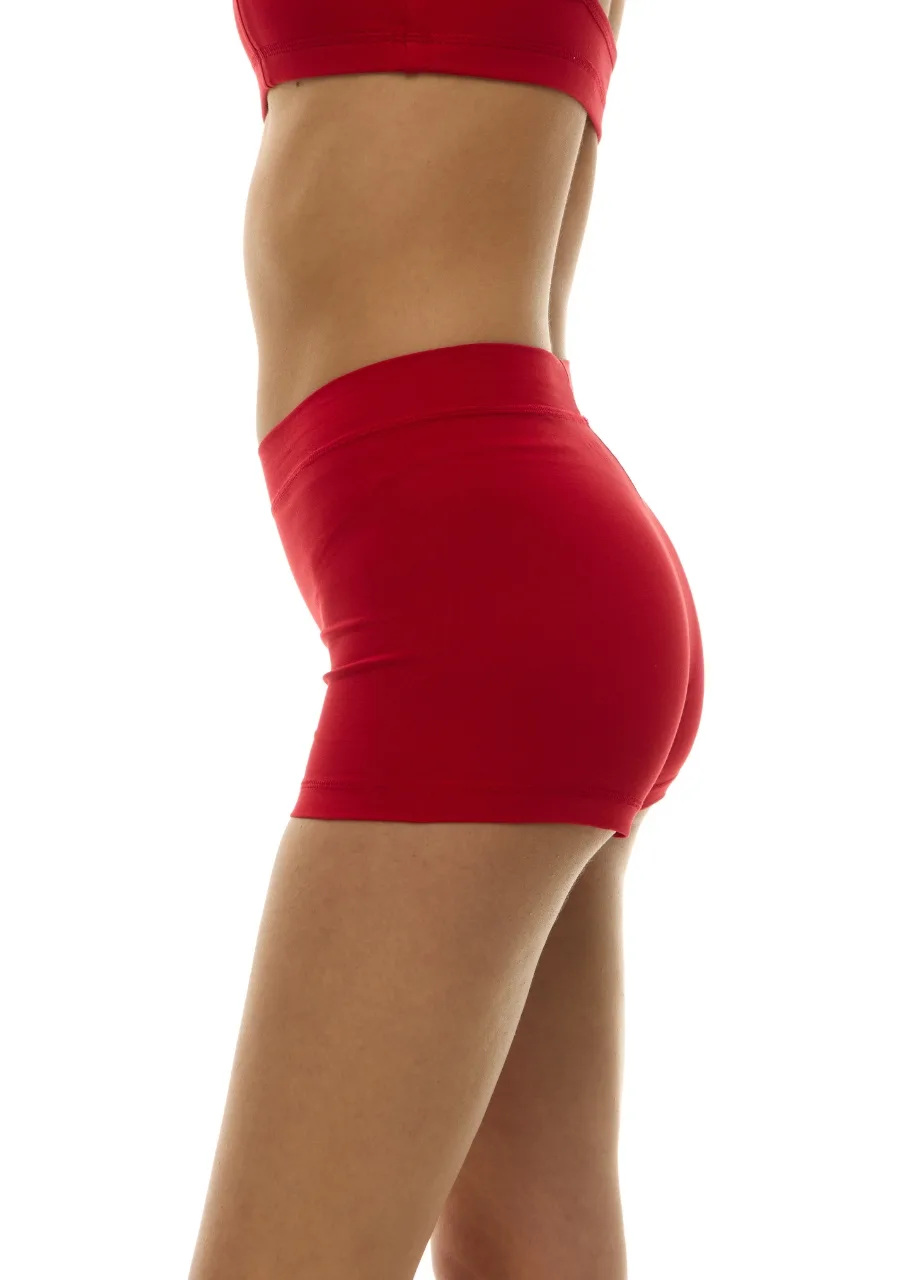 WU1313018 › Str/Cd Wear Side view of a person wearing a red sports bra and matching red shorts.
