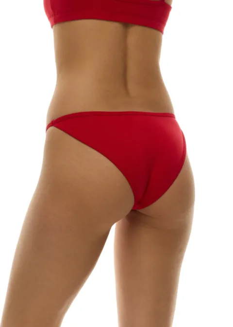 Back view of a person wearing a red bikini bottom with matching red top, photographed from behind.