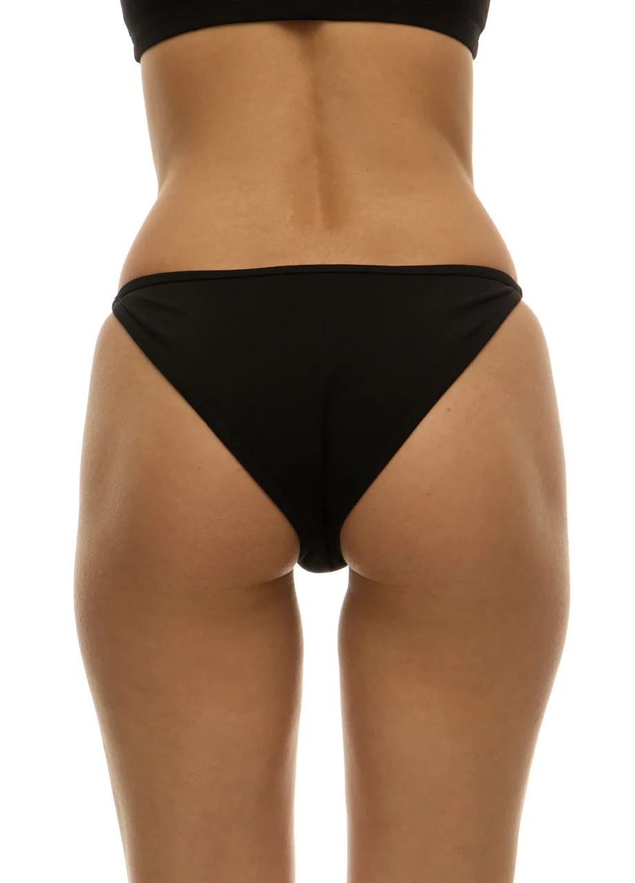 WU131427 › Str/Cd Wear Back view of a person wearing a black bikini bottom against a white background.